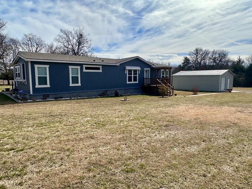 344 JP Cave Road Sherman, TX 75090 - Photo 3 of 21 a view of a house with a yard