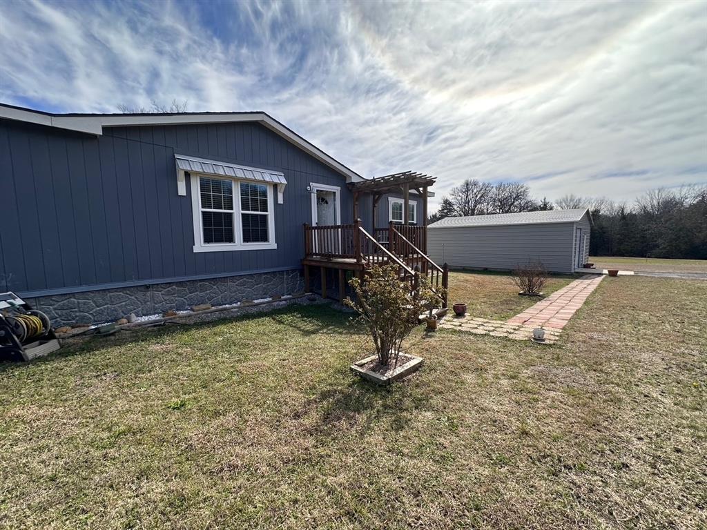 344 JP Cave Road Sherman, TX 75090 - Photo 4 of 21 a backyard of a house with table and chairs
