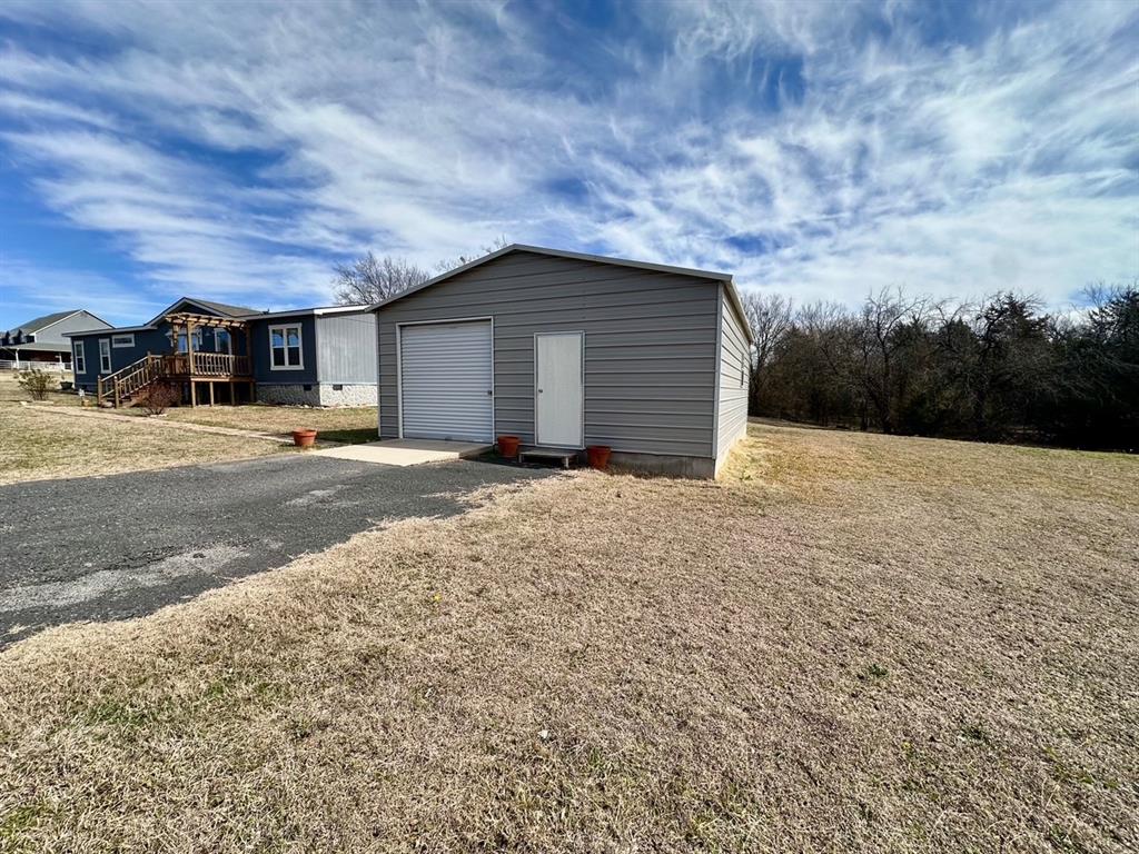 344 JP Cave Road Sherman, TX 75090 - Photo 5 of 21 a view of a house with a yard