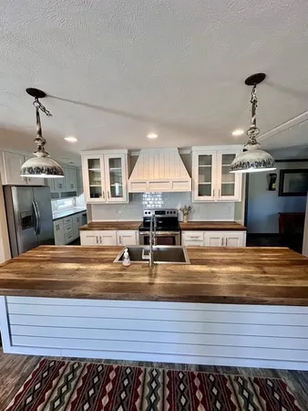 a view of kitchen with wooden floor