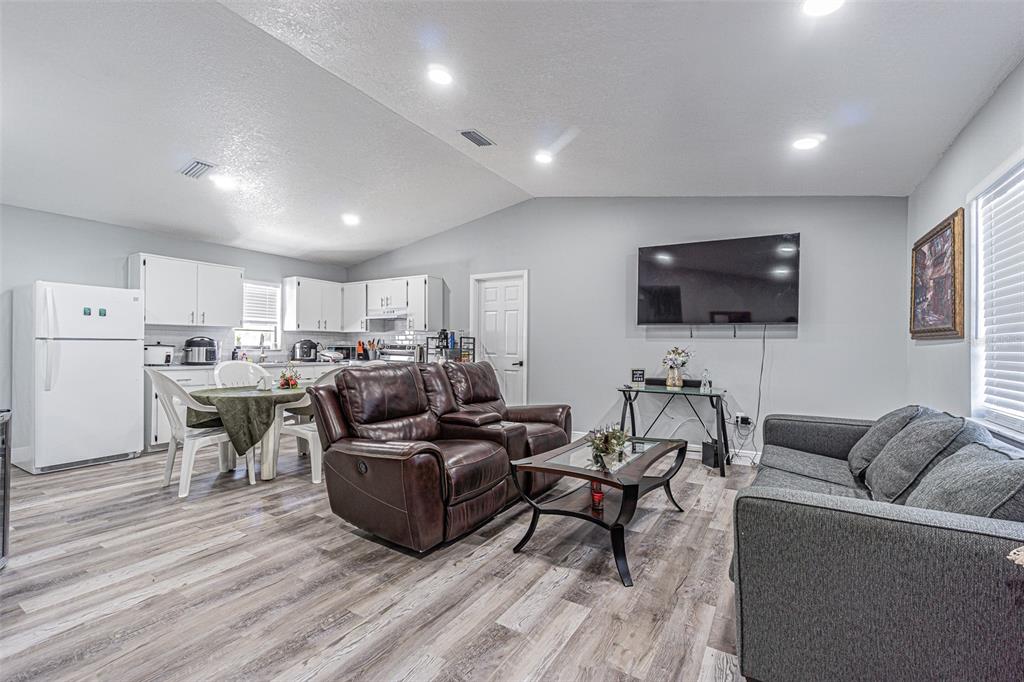 3482 Dow Lane Spring Hill, FL 34609 - Photo 11 of 30 a living room with furniture and a flat screen tv