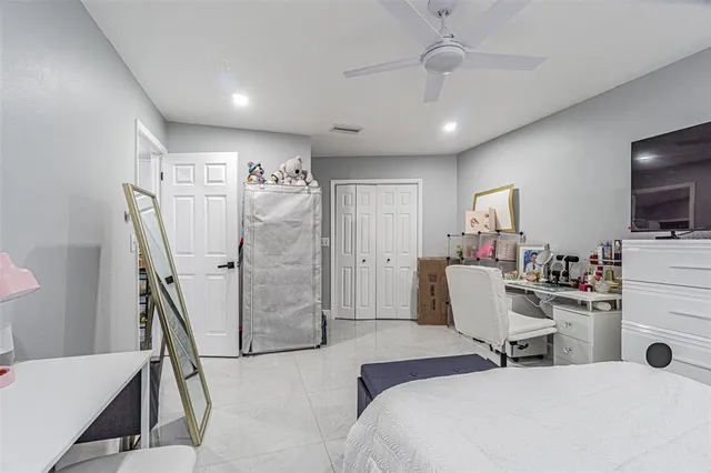 a bathroom with a sink a toilet and shower curtain