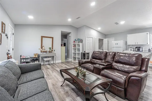 a living room with a flat screen tv and a window