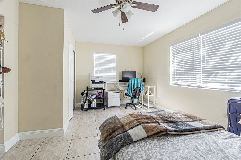 3482 Dow Lane Spring Hill, FL 34609 - Photo 23 of 30 a bed sitting in a room next to a window