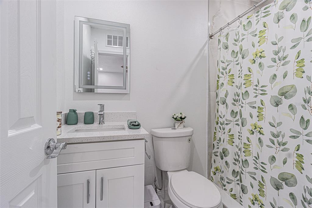 3482 Dow Lane Spring Hill, FL 34609 - Photo 25 of 30 a bathroom with a sink toilet and mirror