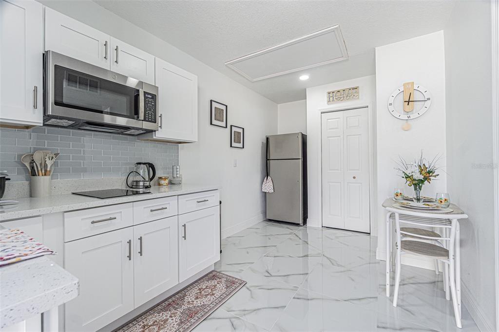 3482 Dow Lane Spring Hill, FL 34609 - Photo 29 of 30 a kitchen with stainless steel appliances granite countertop a refrigerator and a sink