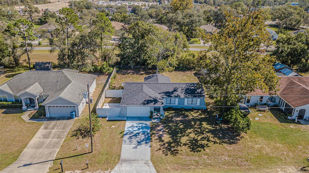 3482 Dow Lane Spring Hill, FL 34609 - Photo 4 of 30 an aerial view of multiple houses with yard