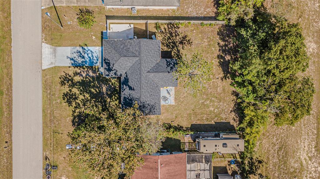 3482 Dow Lane Spring Hill, FL 34609 - Photo 5 of 30 an aerial view of residential house with outdoor space