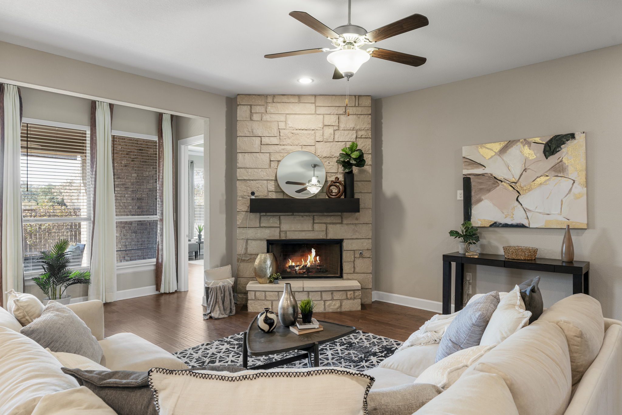 110 Topaz Circle Dripping Springs, TX 78620 - Photo 11 of 40 Rich hardwoods, recessed lighting, generous windows, and tall ceilings add warmth and volume.