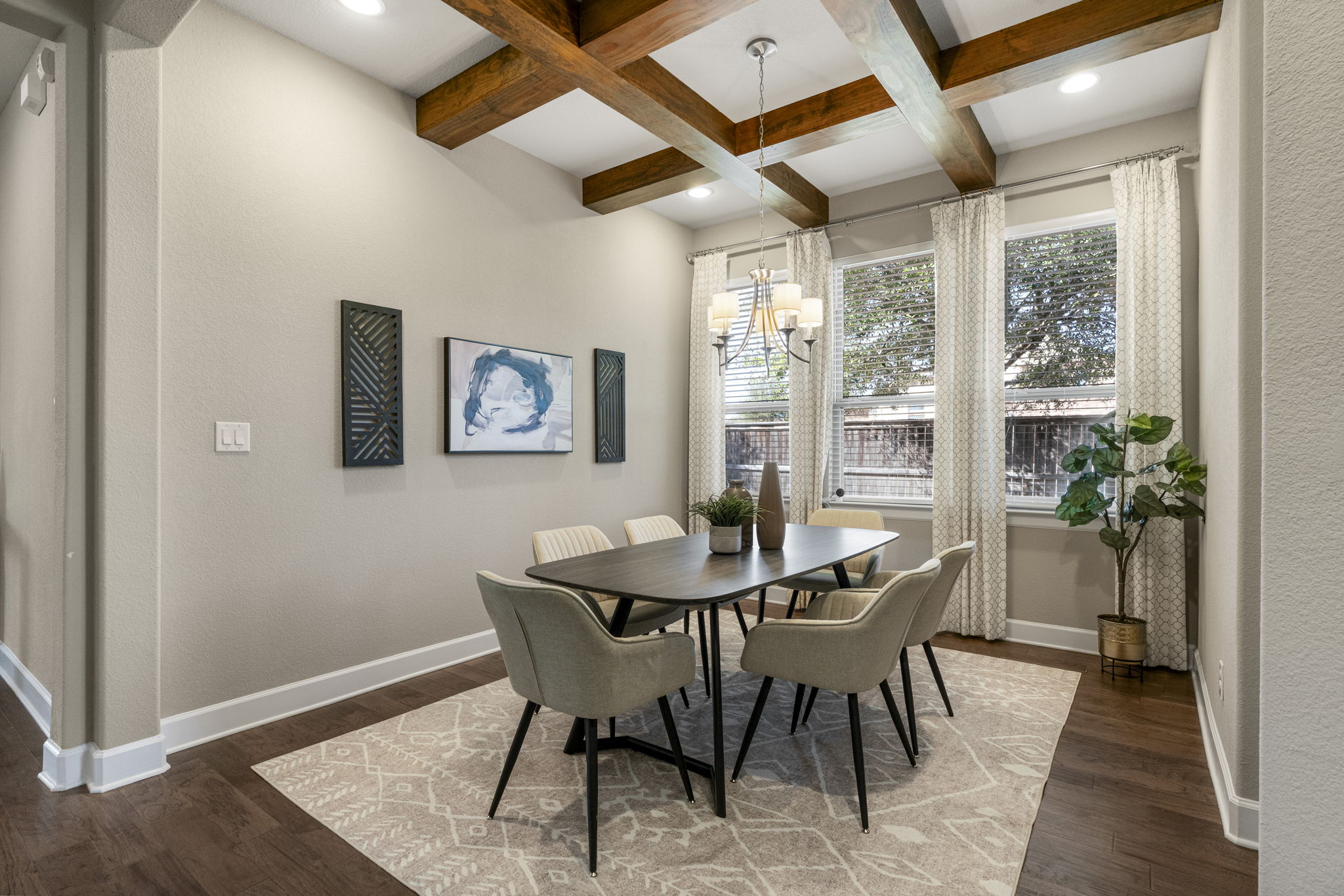 110 Topaz Circle Dripping Springs, TX 78620 - Photo 19 of 40 Featuring beautiful beamed ceilings, windows with tree filled views, and a tasteful chandelier.