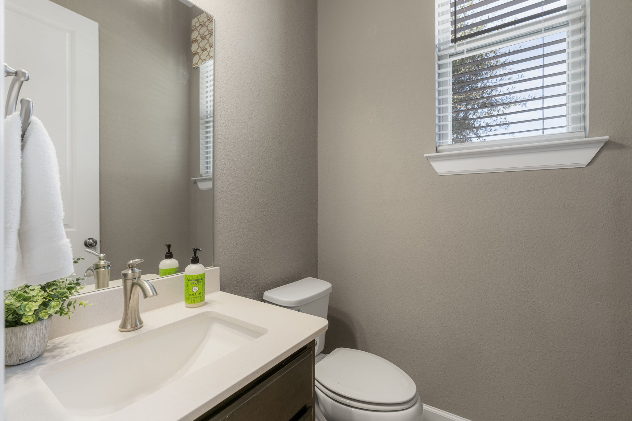 110 Topaz Circle Dripping Springs, TX 78620 - Photo 25 of 40 A convenient guest powder room is located adjacent to the home office.