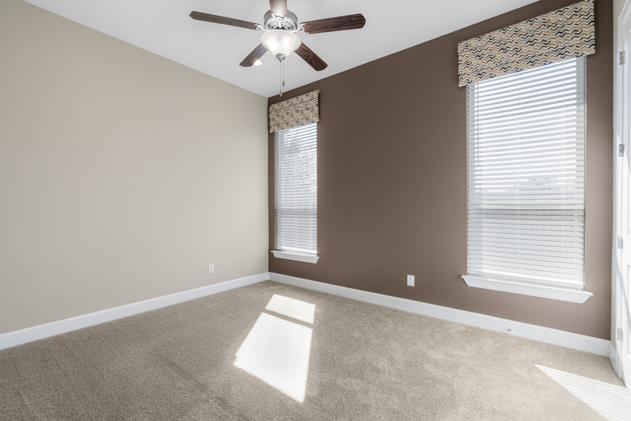 110 Topaz Circle Dripping Springs, TX 78620 - Photo 28 of 40 Two additional bedrooms are situated in their own hallway and share a connected ensuite bath.