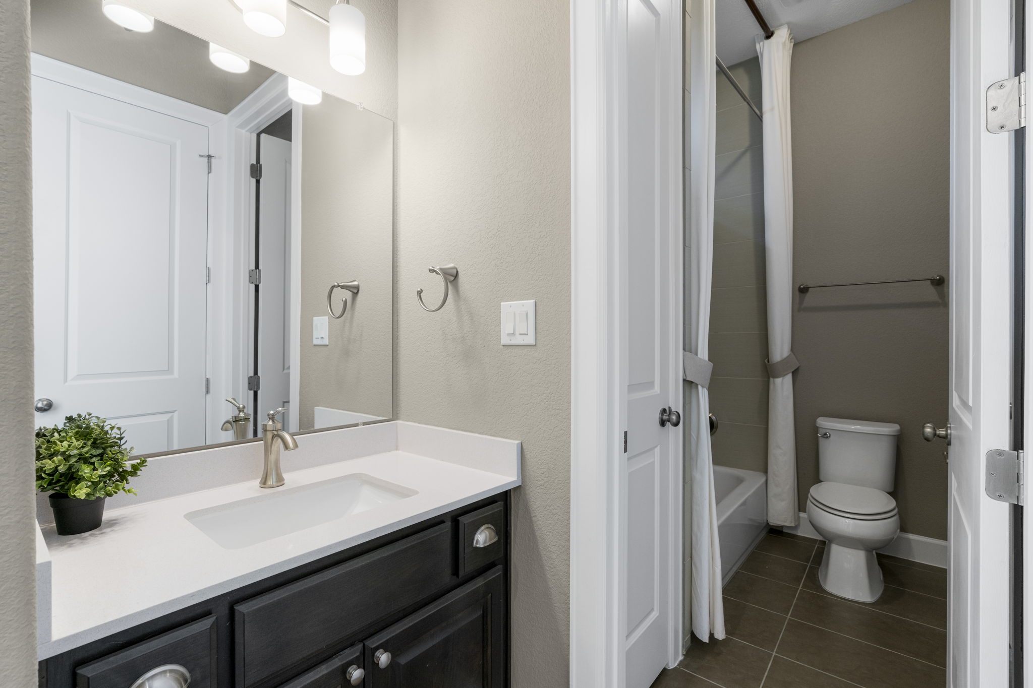 110 Topaz Circle Dripping Springs, TX 78620 - Photo 31 of 40 The private vanity area for the other secondary bedroom, which connects to the shared wet room with the shower/tub combo and toilet.