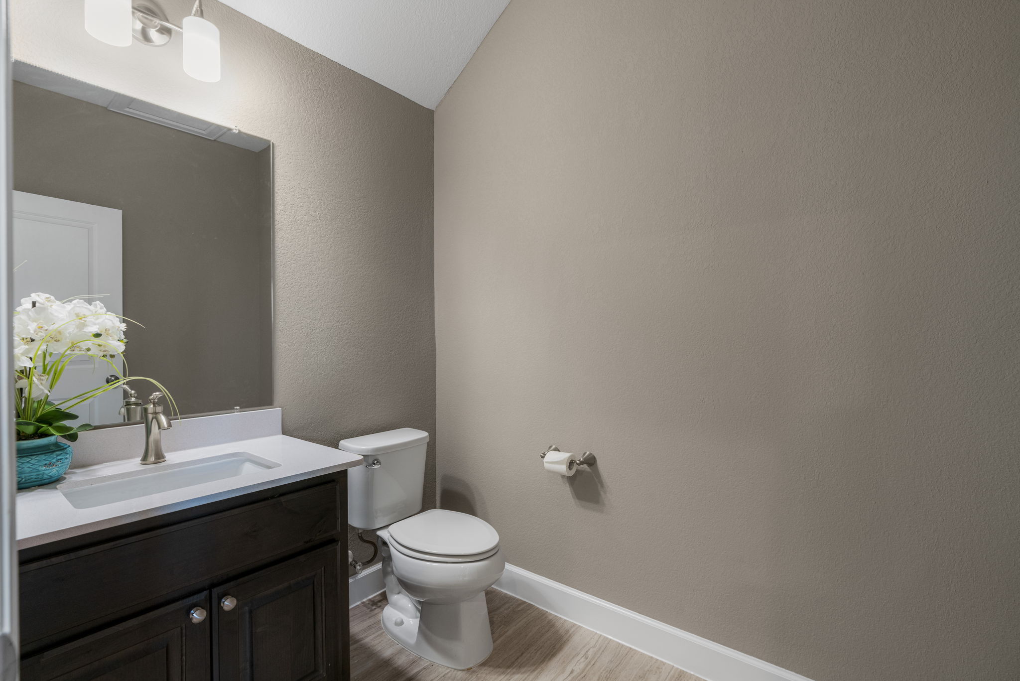 110 Topaz Circle Dripping Springs, TX 78620 - Photo 34 of 40 There's also a convenient guest powder room upstairs off the game room.