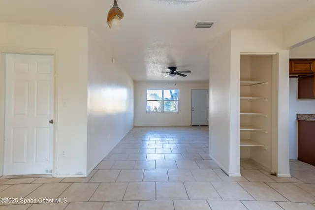 a view of an empty room and window