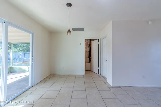 a view of an empty room and window