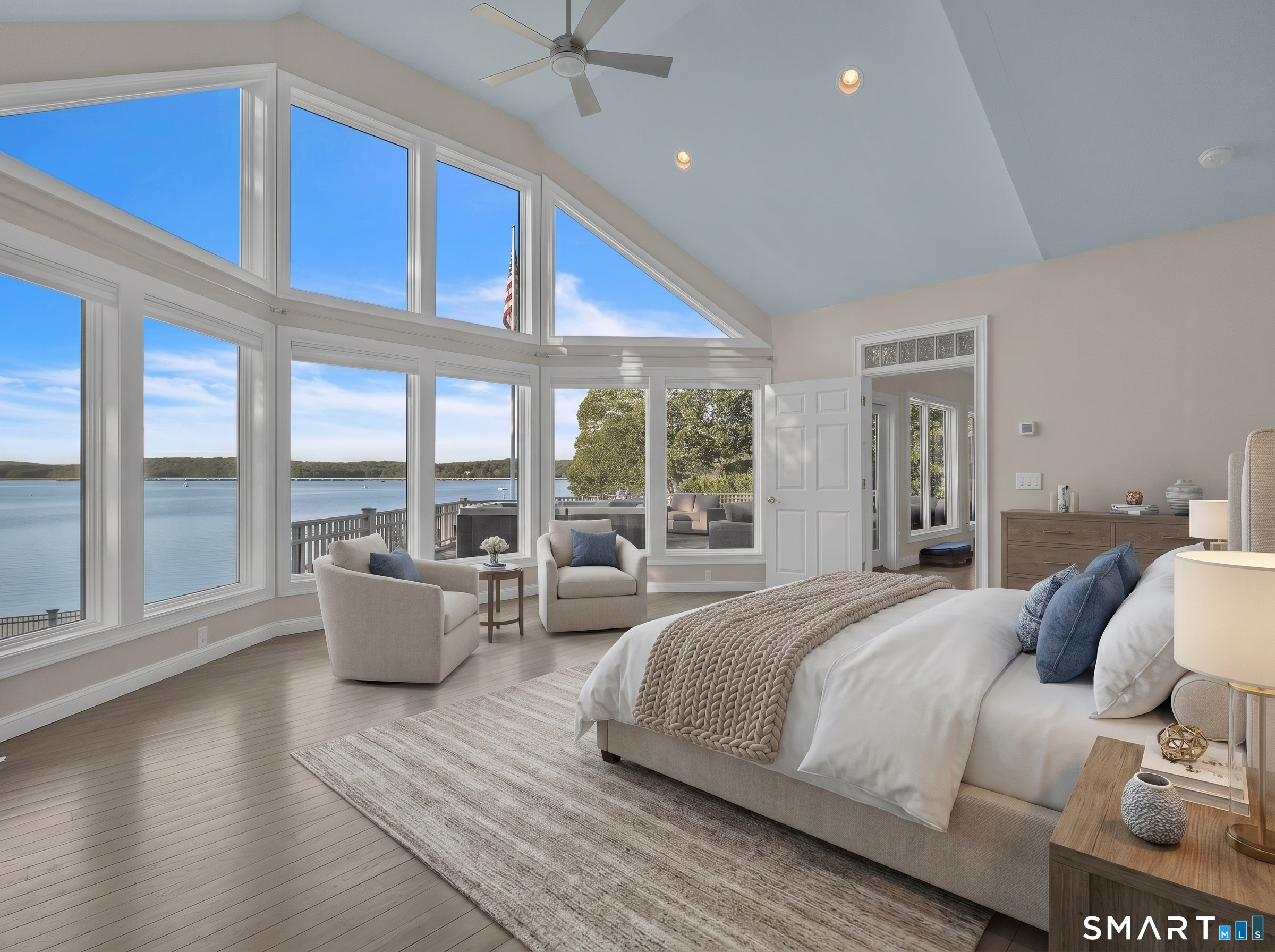 12 Rocky Point Road Old Saybrook, CT 06475 - Photo 11 of 28 a spacious bedroom with a large bed and a large window