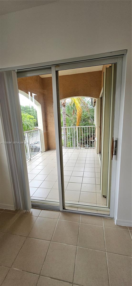 3830 Lyons Road, Unit 3013 Coconut Creek, FL 33073 - Photo 12 of 23 Primary Bedroom - Sliding Glass Door to Balncony