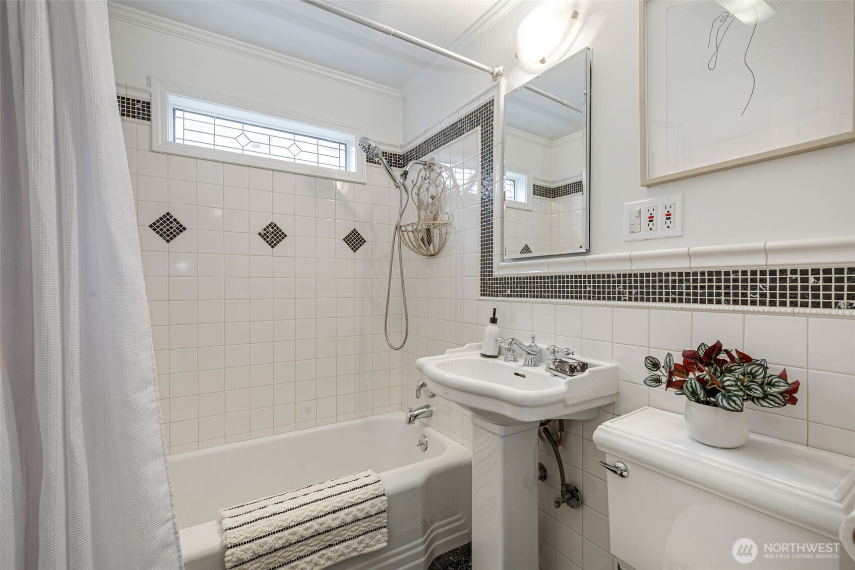 8115 34th Avenue Southwest Seattle, WA 98126 - Photo 15 of 39 a bathroom with a sink toilet and shower