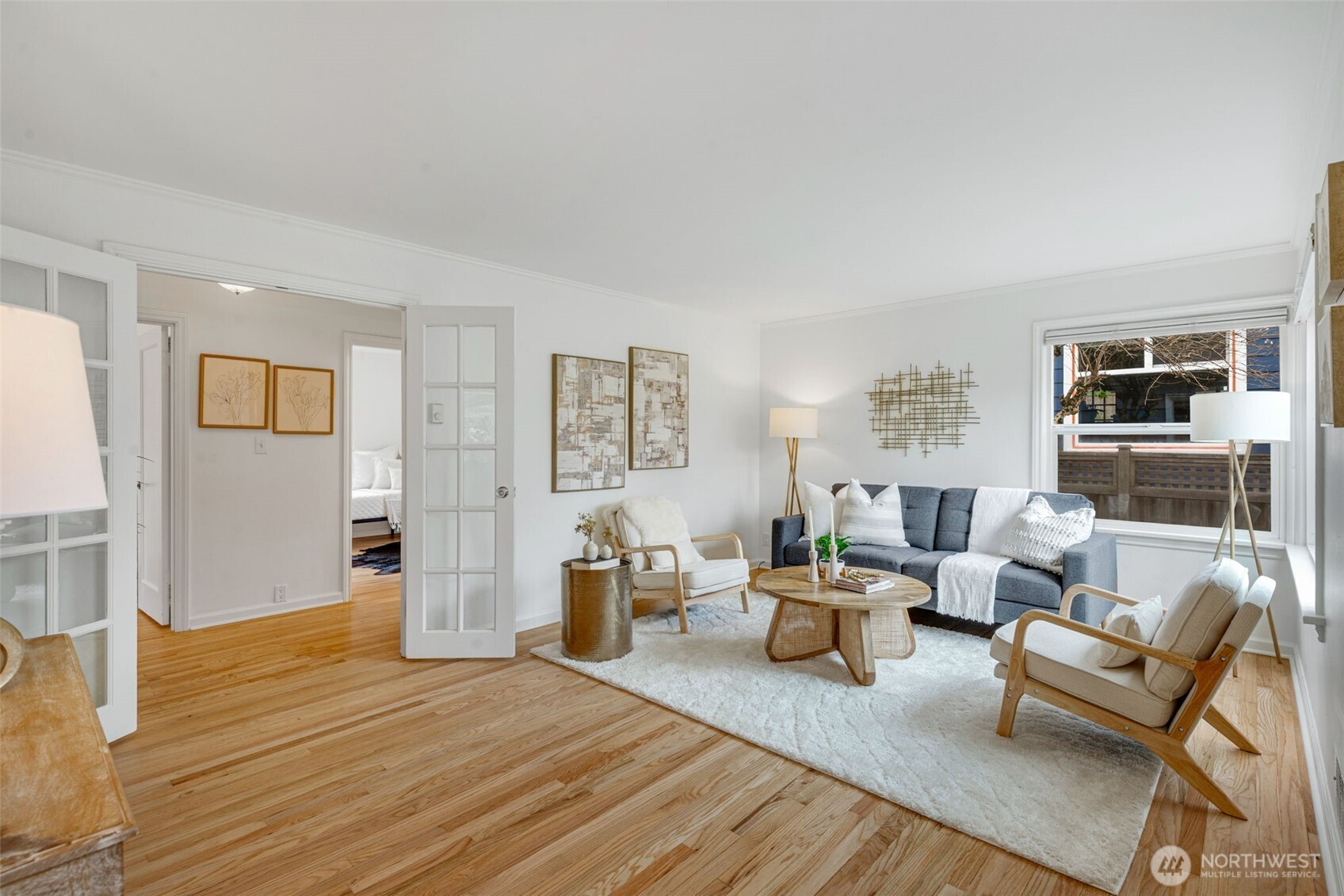 8115 34th Avenue Southwest Seattle, WA 98126 - Photo 2 of 39 a living room with furniture and a wooden floor