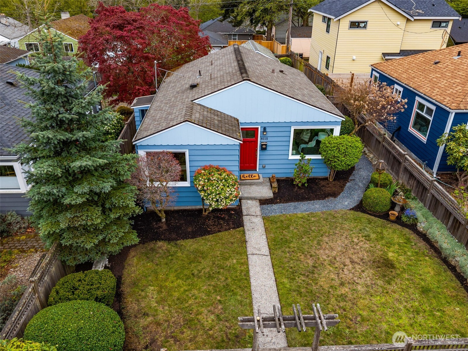 8115 34th Avenue Southwest Seattle, WA 98126 - Photo 24 of 39 a front view of a house with garden