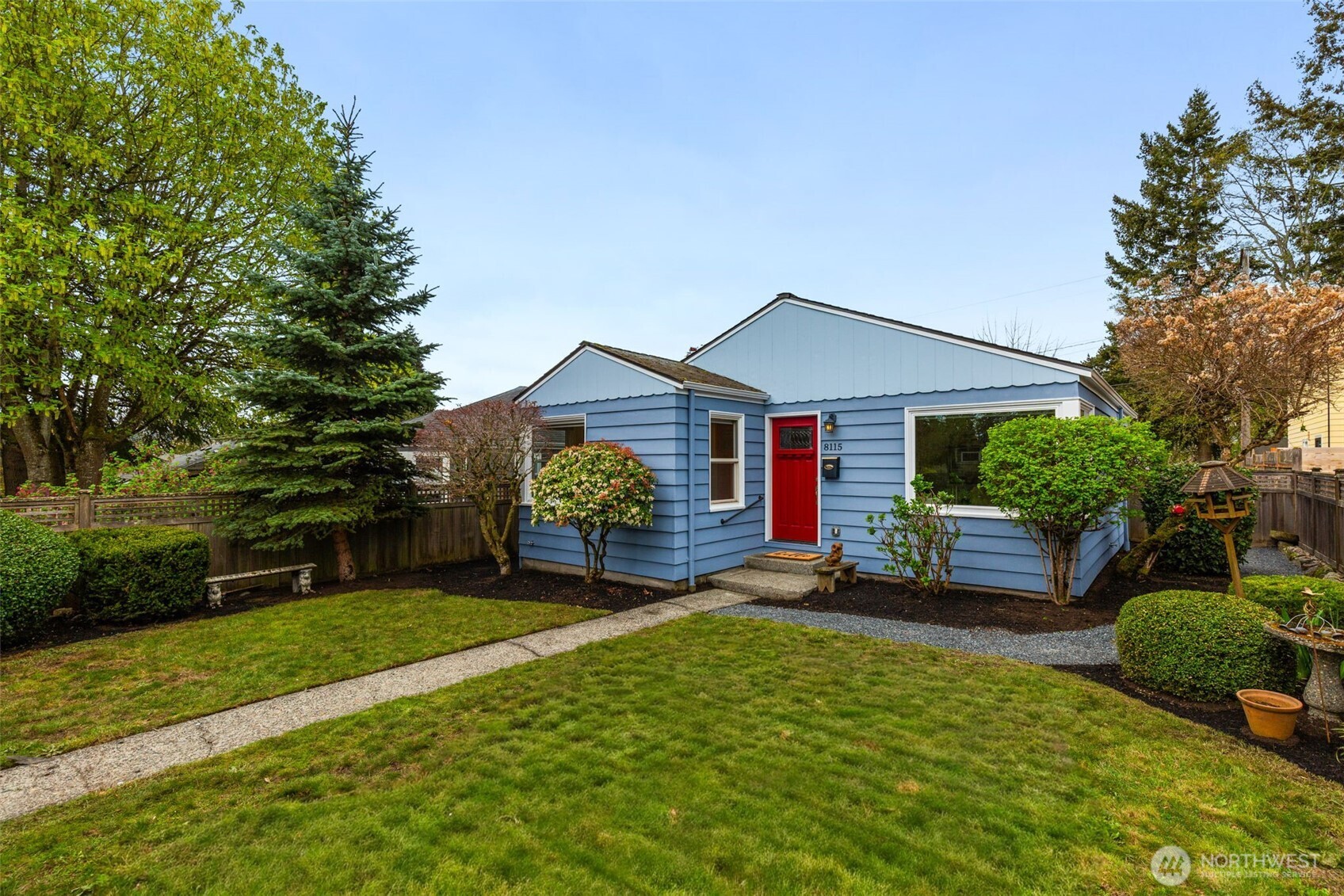 8115 34th Avenue Southwest Seattle, WA 98126 - Photo 27 of 39 a front view of a house with garden