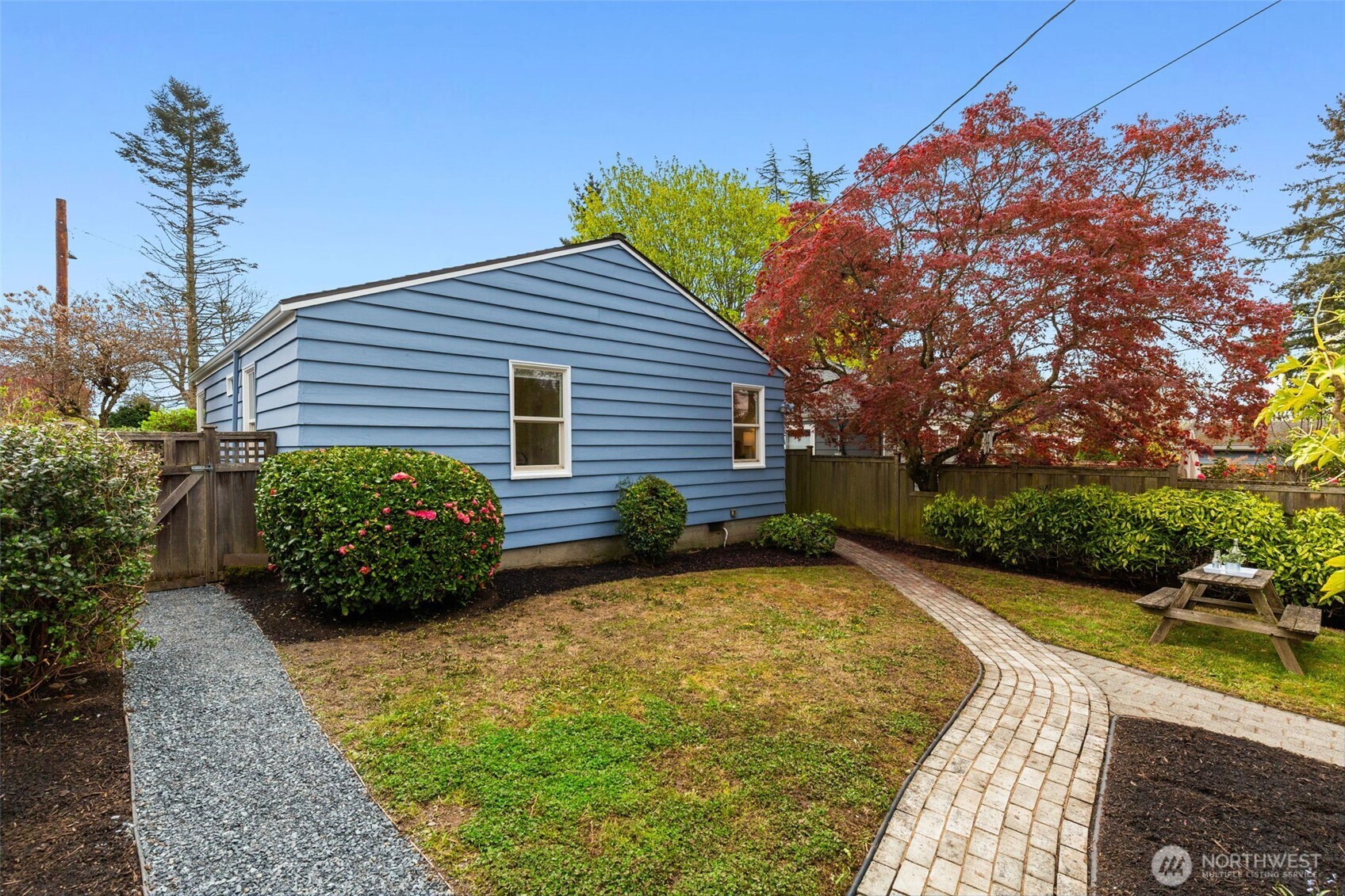 8115 34th Avenue Southwest Seattle, WA 98126 - Photo 28 of 39 a view of a house with a yard