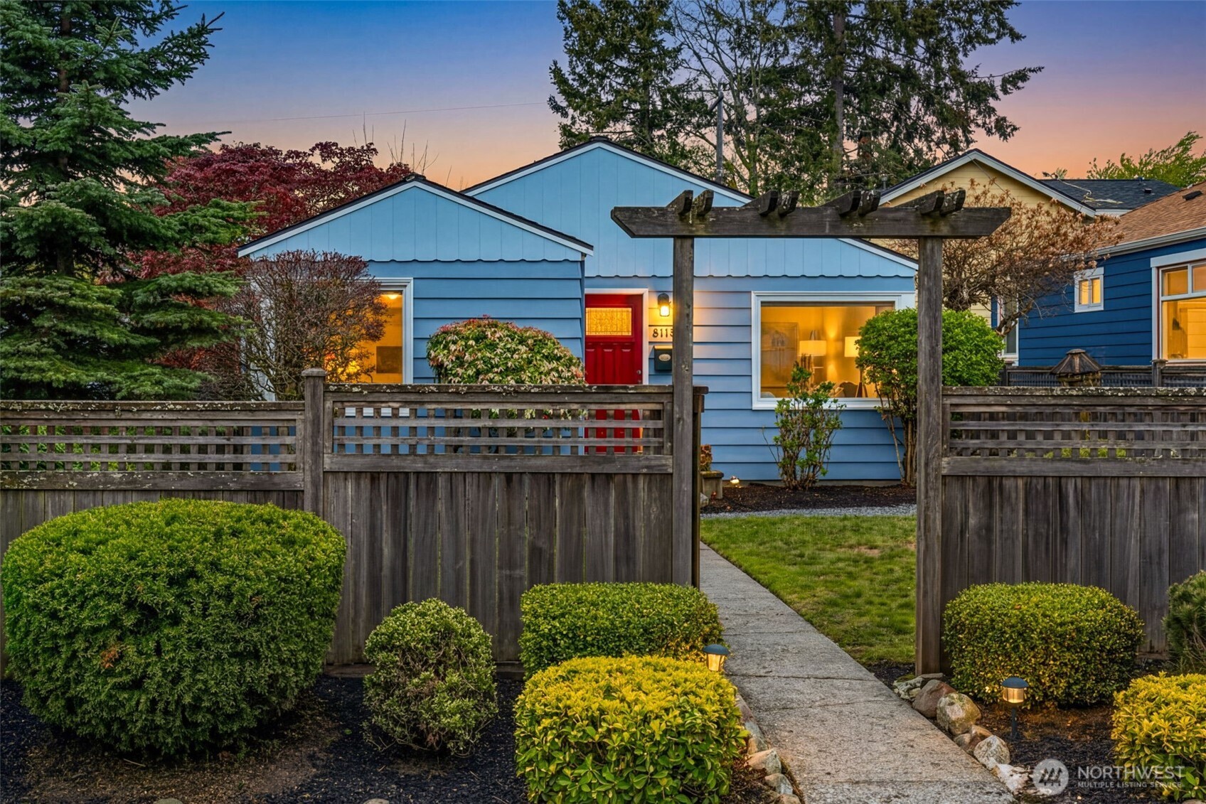 8115 34th Avenue Southwest Seattle, WA 98126 - Photo 37 of 39 a front view of a house with garden