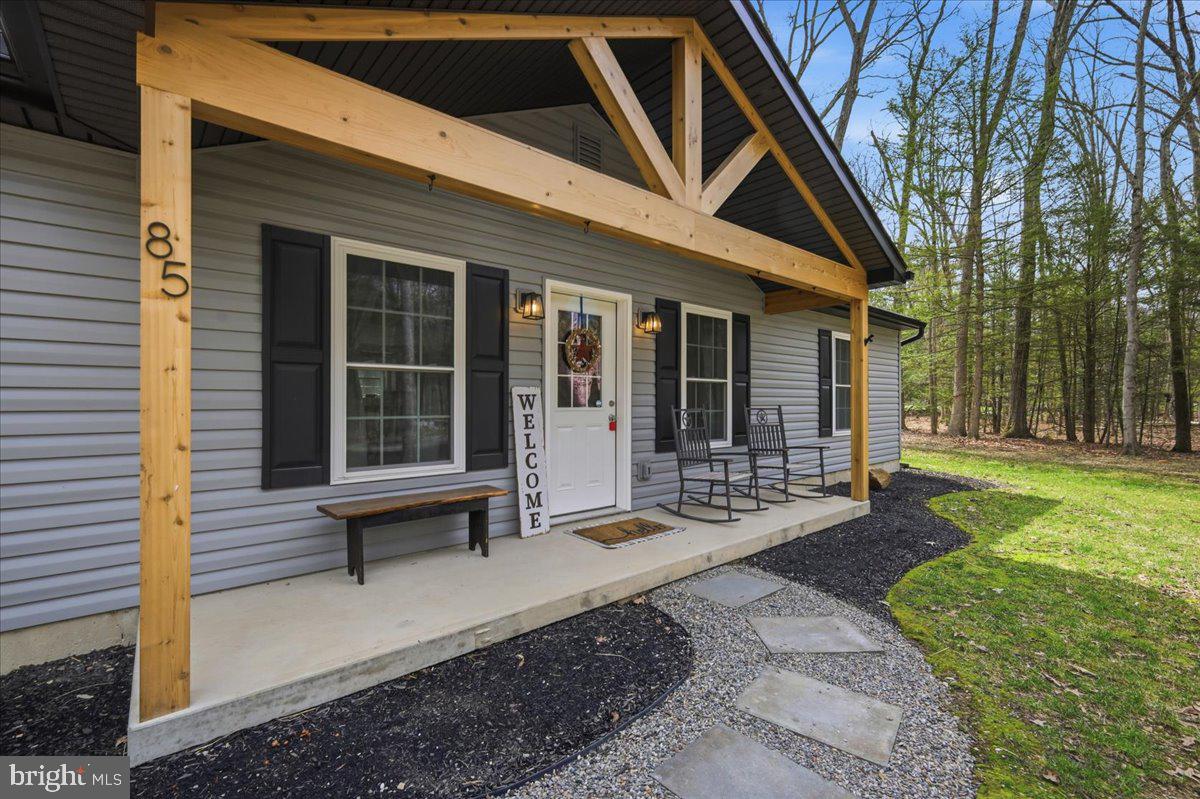 85 McCool Lane Lehighton, PA 18235 - Photo 6 of 39 a view of a house with backyard sitting area and porch