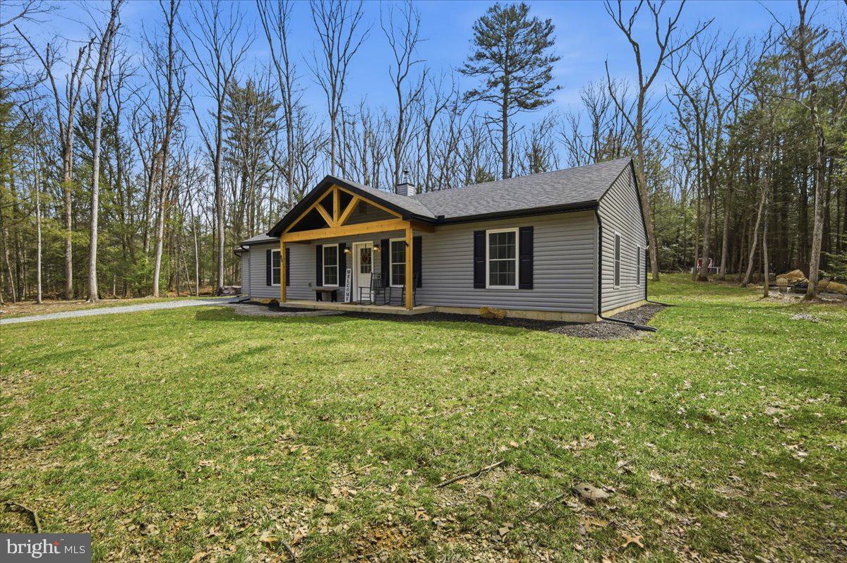 85 McCool Lane Lehighton, PA 18235 - Photo 7 of 39 a front view of a house with garden