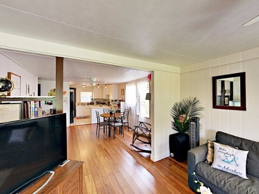 372 Pua Road Kapaa, HI 96746 - Photo 4 of 20 a living room with furniture wooden floor and a kitchen view