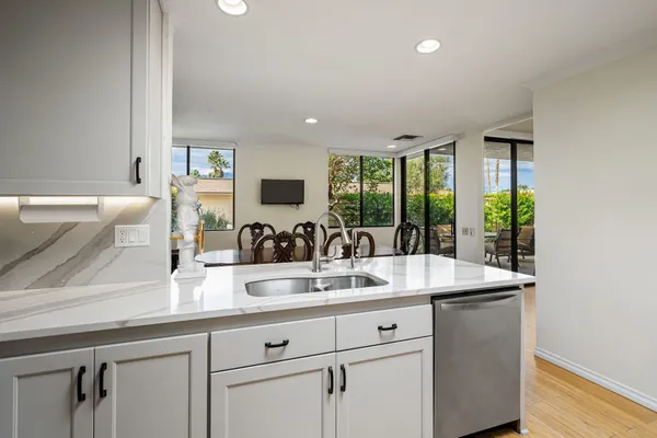 a kitchen with sink and window