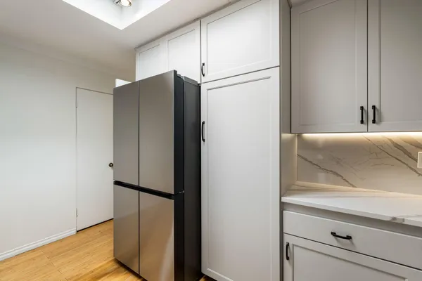 a bathroom with a shower and a sink