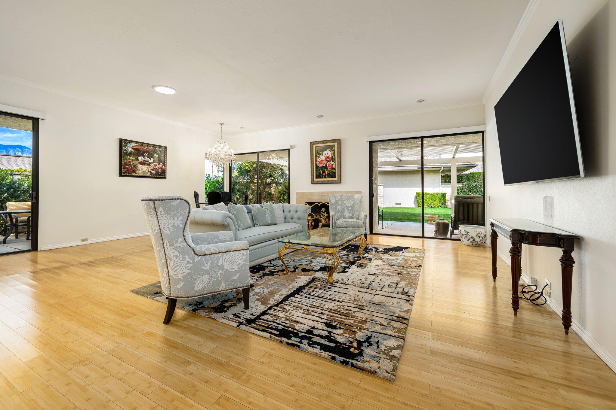 1 Rutgers Court Rancho Mirage, CA 92270 - Photo 2 of 37 a living room with fireplace furniture and a flat screen tv