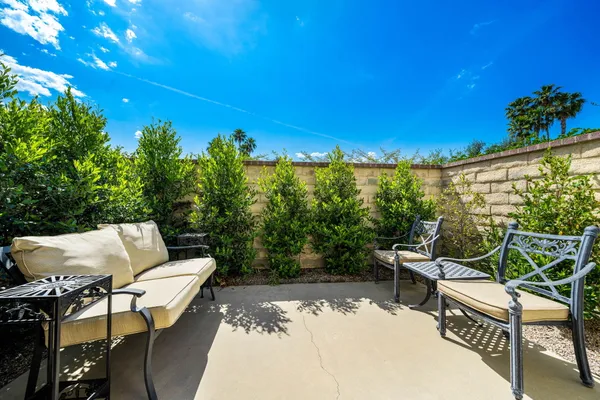 a view of a tables and chairs in patio