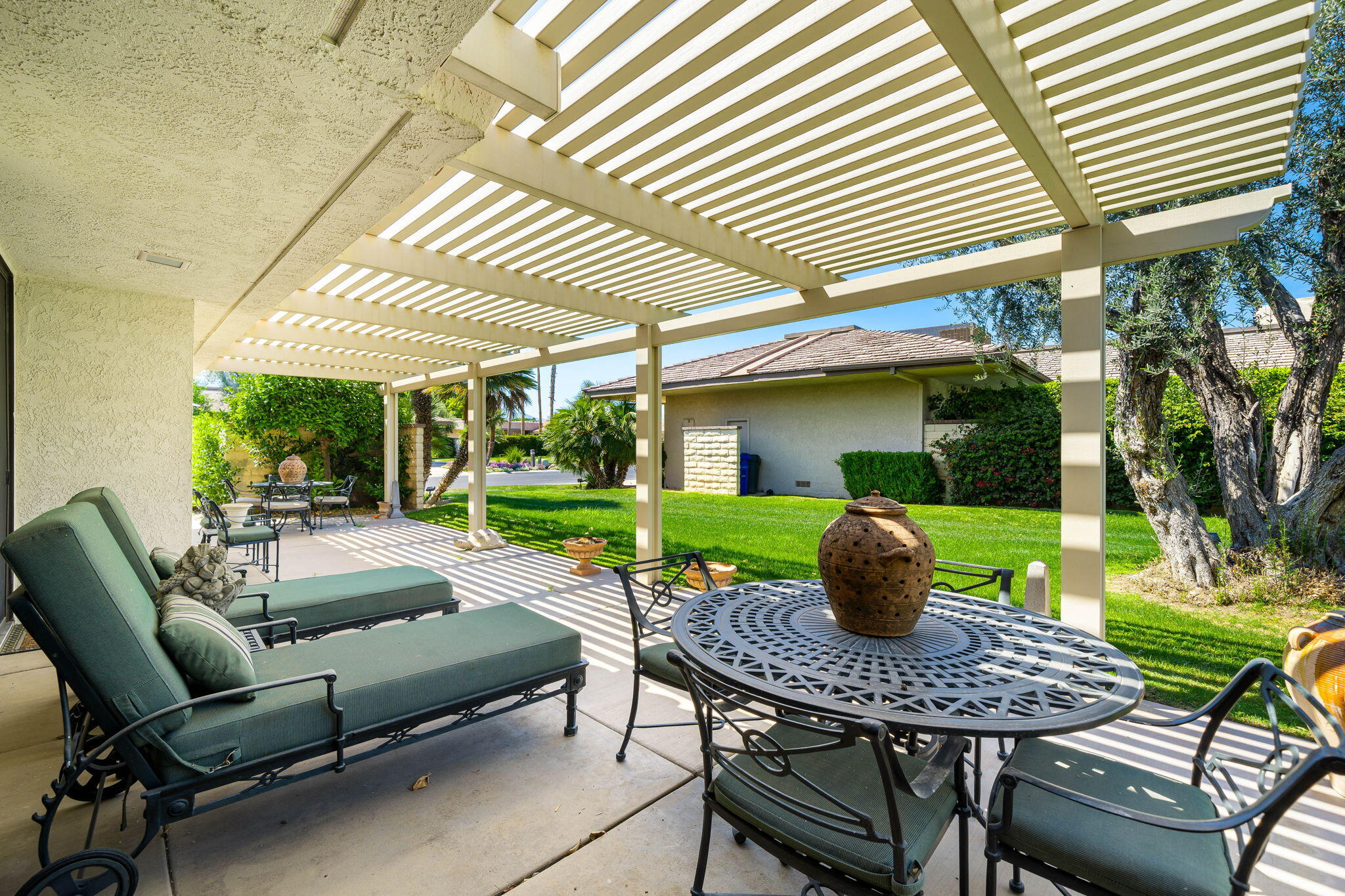 1 Rutgers Court Rancho Mirage, CA 92270 - Photo 29 of 37 a view of a patio with a table and chairs