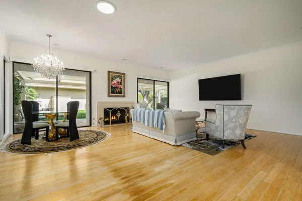 a living room with fireplace furniture and a flat screen tv