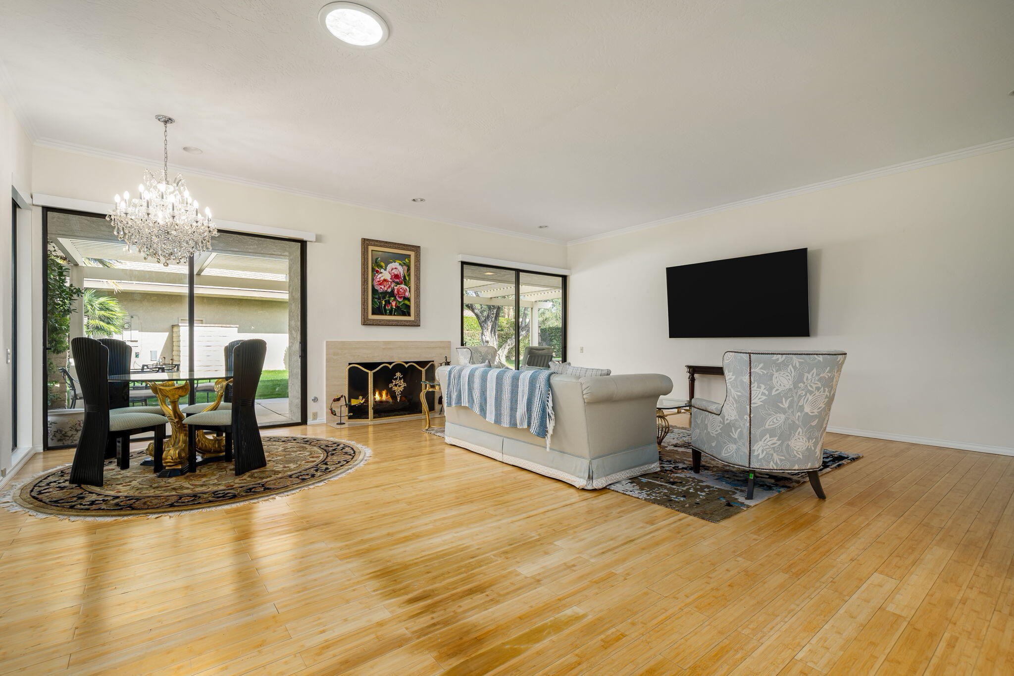 1 Rutgers Court Rancho Mirage, CA 92270 - Photo 4 of 37 a living room with fireplace furniture and a flat screen tv