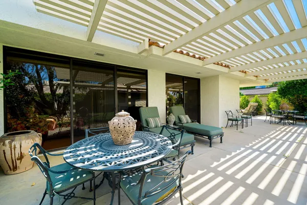 a outdoor living space with furniture and a potted plant