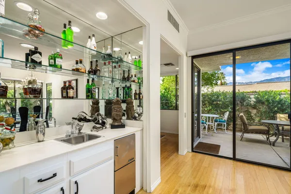 a room with sink and view of living room