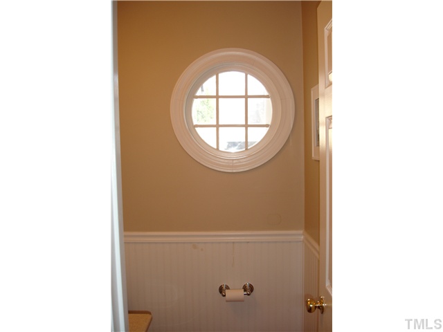 9105 Doublebit Drive Raleigh, NC 27615 - Photo 16 of 20 Charming half bath with bead board and a decorative window.