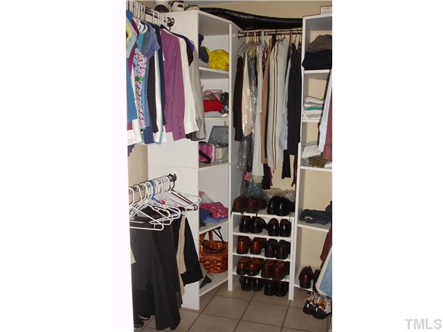 9105 Doublebit Drive Raleigh, NC 27615 - Photo 17 of 20 New floor and shelving added to the walk in closet.