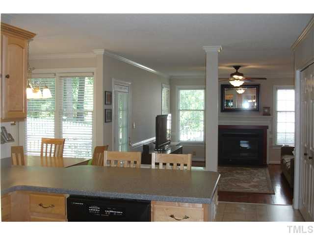 9105 Doublebit Drive Raleigh, NC 27615 - Photo 3 of 20 This is such a wonderful combination having all these areas open to one another! Gas logs in the fireplace, hardwood floors added and a new light fixture/fan.