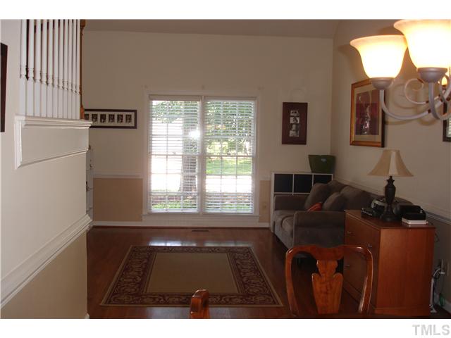 9105 Doublebit Drive Raleigh, NC 27615 - Photo 4 of 20 Living room area with REAL hardwood floors, not laminate. Great natural light. This room is open to the dining room.