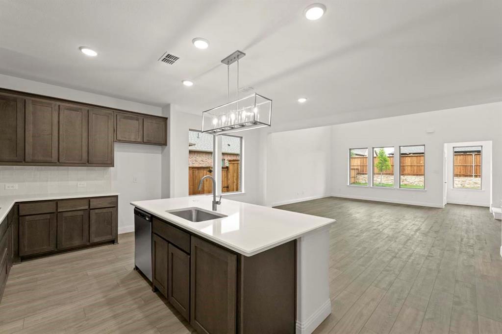 1443 Canadian Lane Van Alstyne, TX 75495 - Photo 4 of 24 04-1443-canadian-ln-van-alstyne-tx-kitchen-living-area