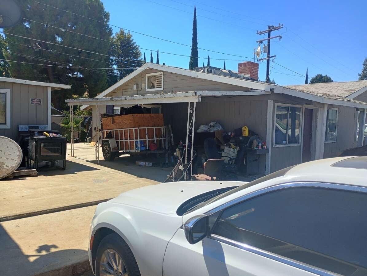 21811 Highway 198 Exeter, CA 93221 - Photo 5 of 6 a view of a house with a patio and furniture