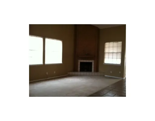 a black and white photo of a fireplace