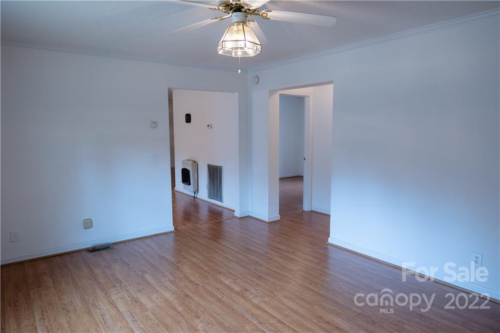 5040 Tabernacle Road Lancaster, SC 29720 - Photo 16 of 26 a view of an empty room with a window and wooden floor