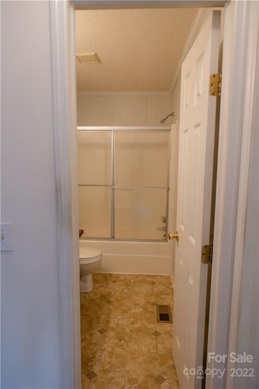 5040 Tabernacle Road Lancaster, SC 29720 - Photo 17 of 26 a bathroom with a glass shower door