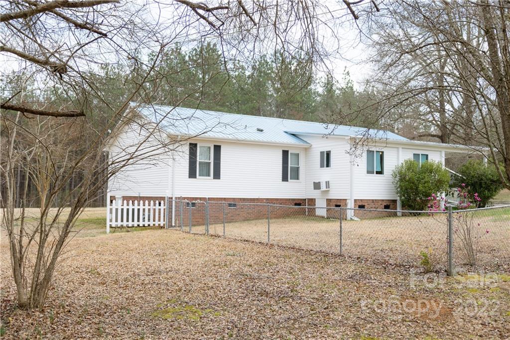 5040 Tabernacle Road Lancaster, SC 29720 - Photo 2 of 26 a front view of a house with a yard